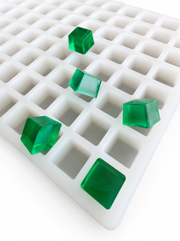 2.625mL square gummy mold with 266 cavities and translucent emerald green square gummies on a clean white background